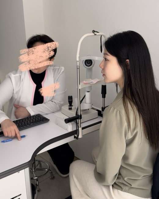 Yerim seated at a facial diagnostic scanner during a clinic visit